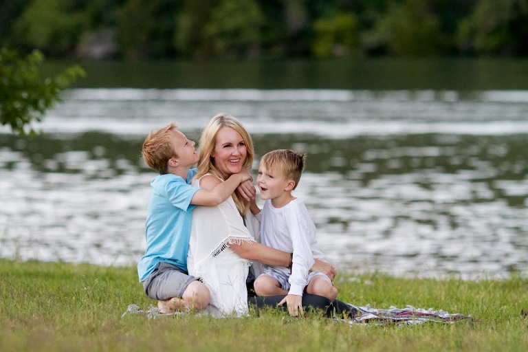 Mom and two boys by the lake