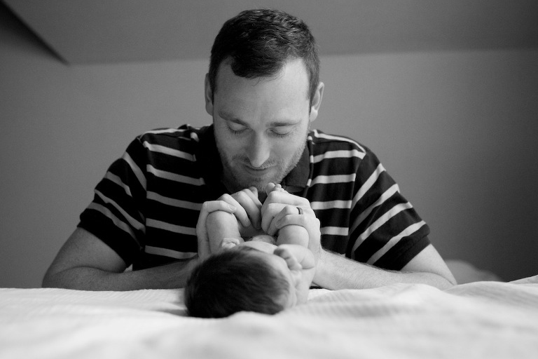 Dad paying with baby