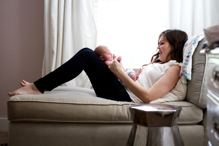 Mom and baby by window