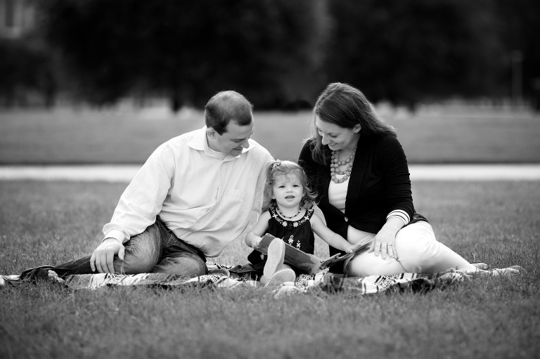 Mom and dad reading with daughter