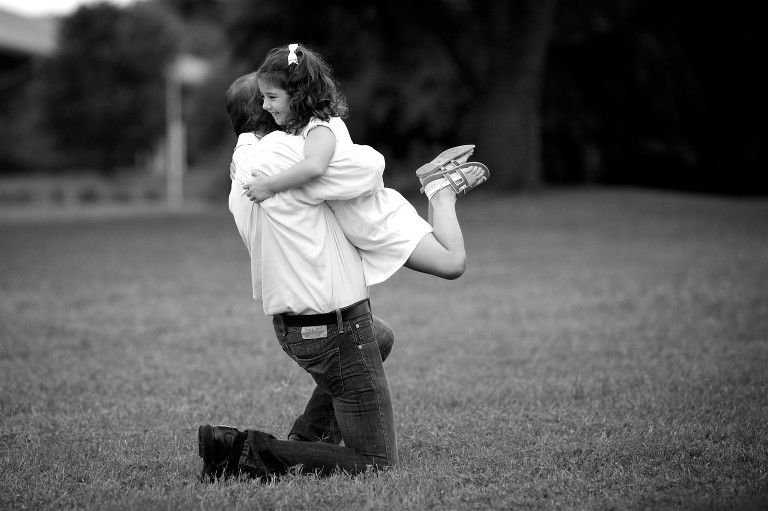 Dad hugging daughter