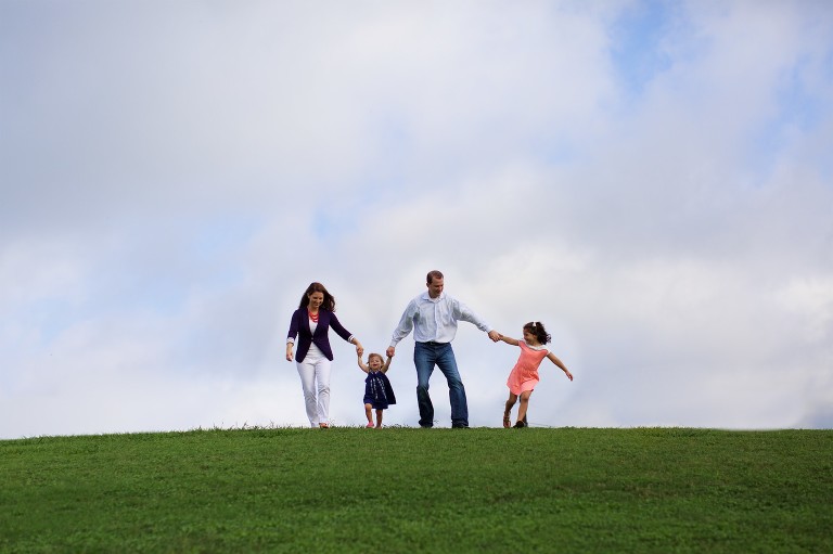 Family running down hill