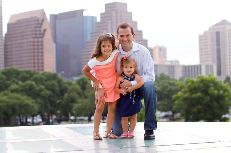 Family photo of dad with two girls