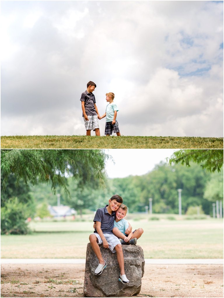 Bother holding hands and hugging in outdoor location