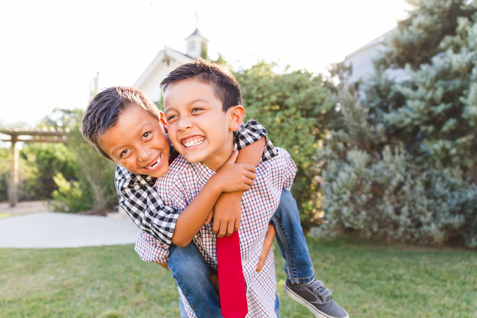 Two brothers playing piggy back